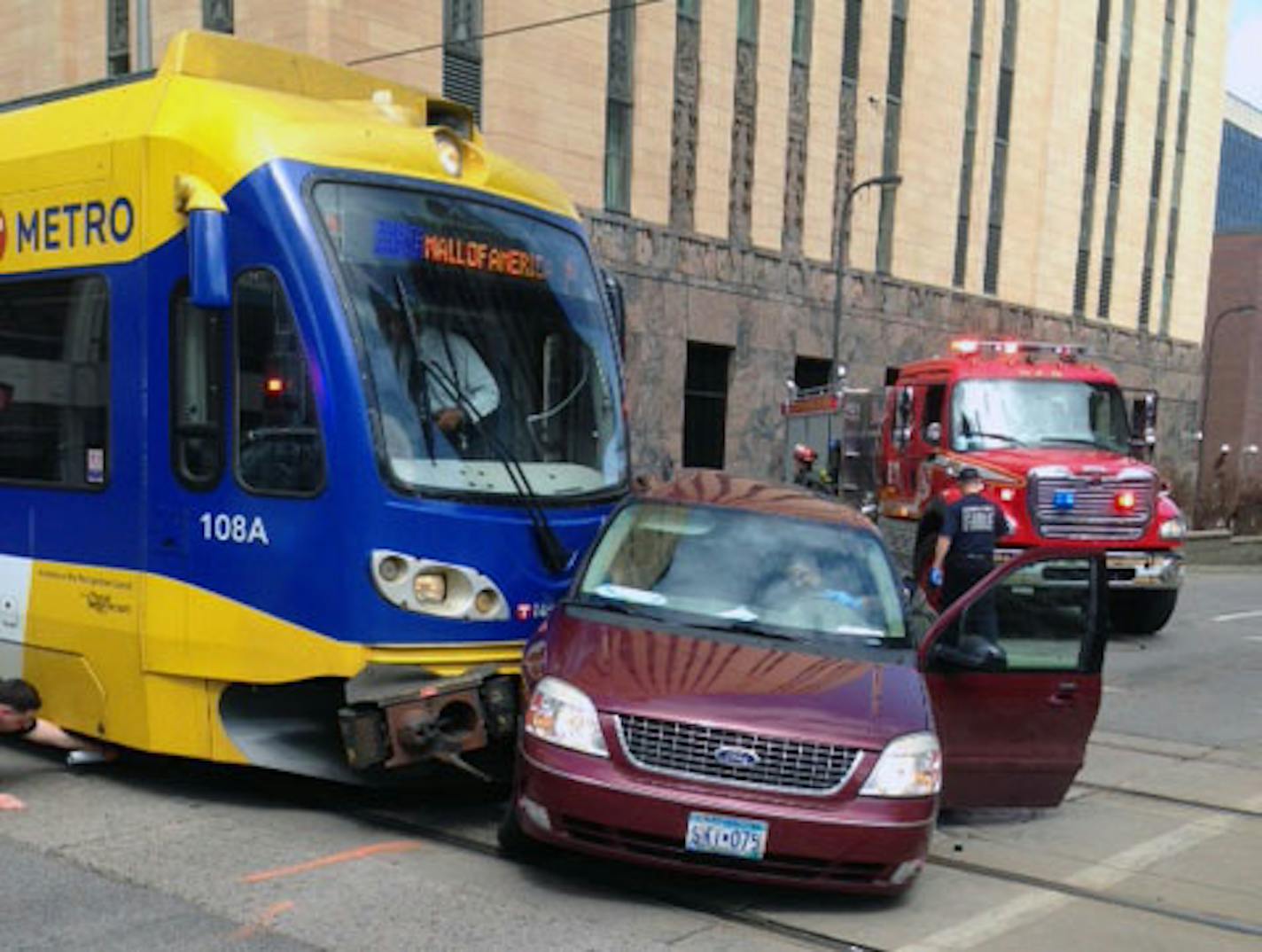 A light rail train struck a car Sunday afternoon, April 12, 2015, in downtown Minneapolis, leaving the tracks blocked. The collision occurred about 12:45 p.m. The car's driver, a man, did not appear to be seriously hurt. (Glen Crevier, Star Tribune)