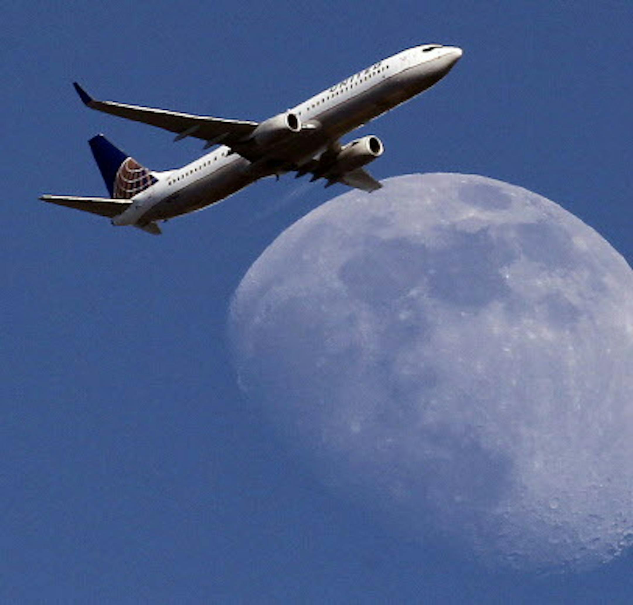 FILE - In this July 26, 2015, file photo, a United Airlines passenger airplane passes over Whittier, Calif., on its way to Los Angeles International Airport. Fliers in certain markets are seeing bargain flights as fare wars make a limited return. (AP Photo/Nick Ut, File)