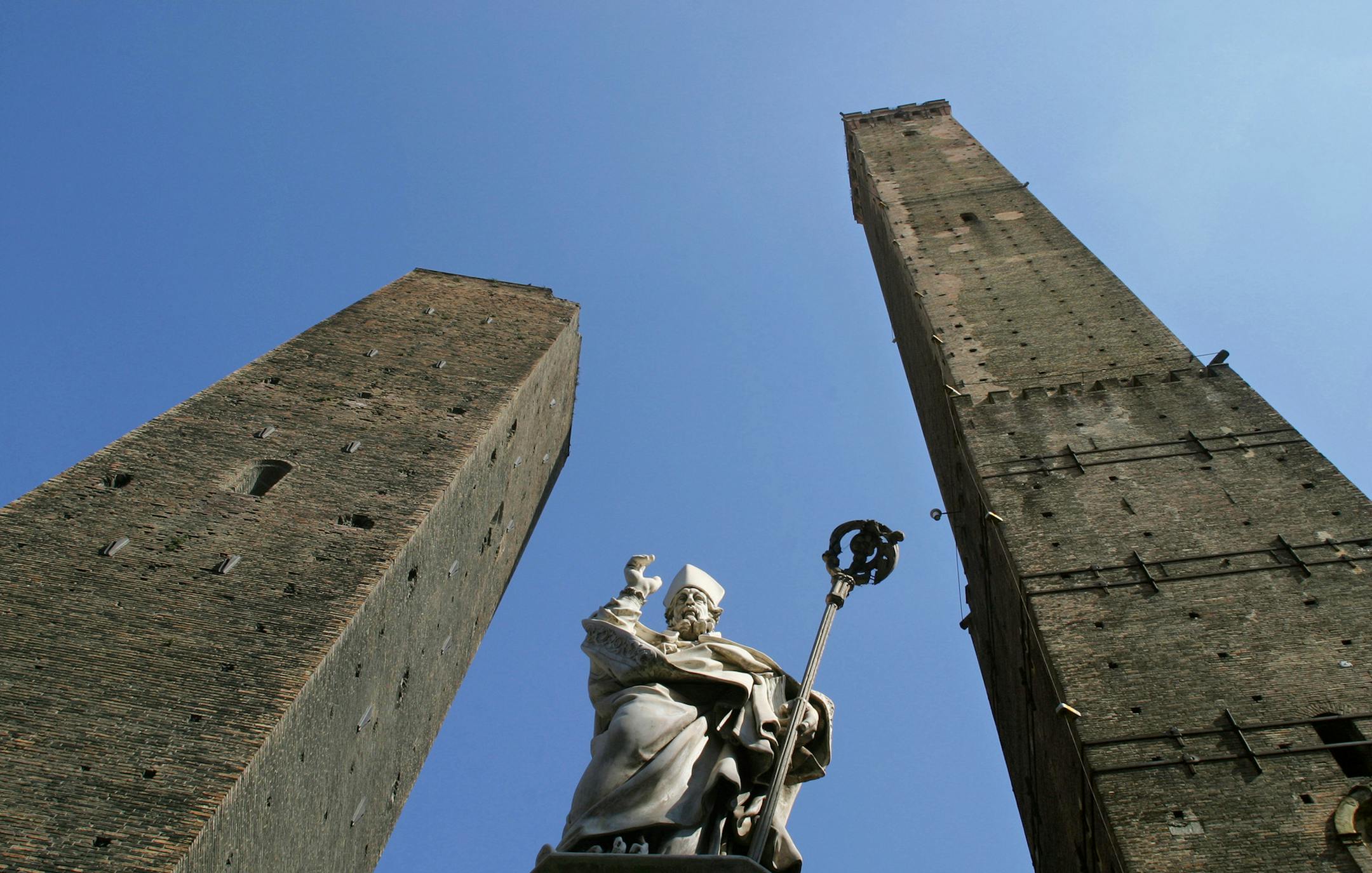 The statue of Saint Petronius stands at the foot of the "due torri," or two towers, of Bologna. Provided by Comune di Bologna.