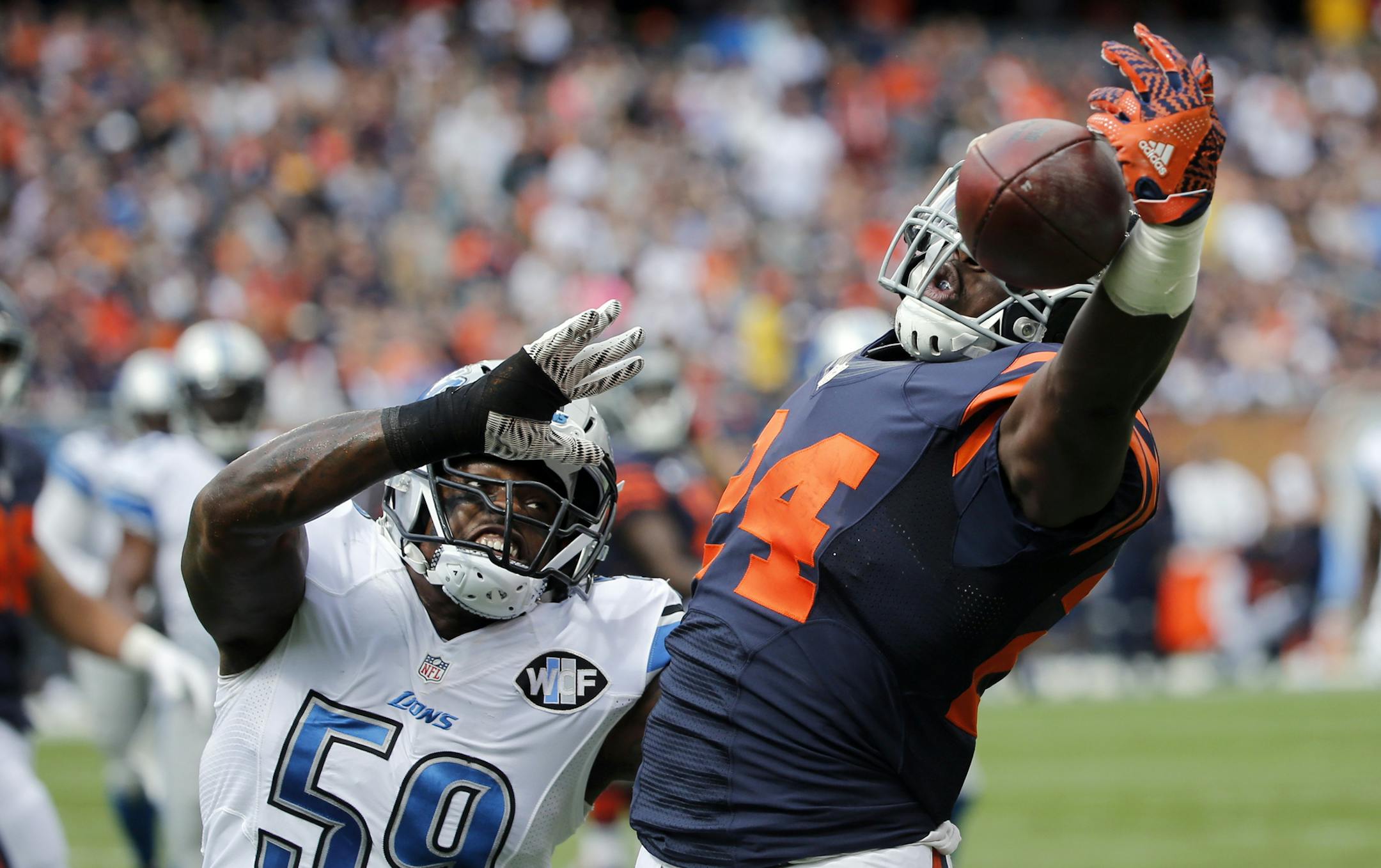 Chicago Bears running back Jordan Howard (24) is unable to make the catch but the pass interference was called again Detroit Lions middle linebacker Tahir Whitehead (59) on the play during the first half of an NFL football game, Sunday, Oct. 2, 2016, in Chicago. (AP Photo/Charles Rex Arbogast)