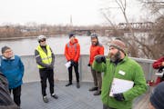 Tyler Pederson, Design Project Manager with the Minneapolis Park and Recreation Board, leads a site visit and Q&A with local residents about building 