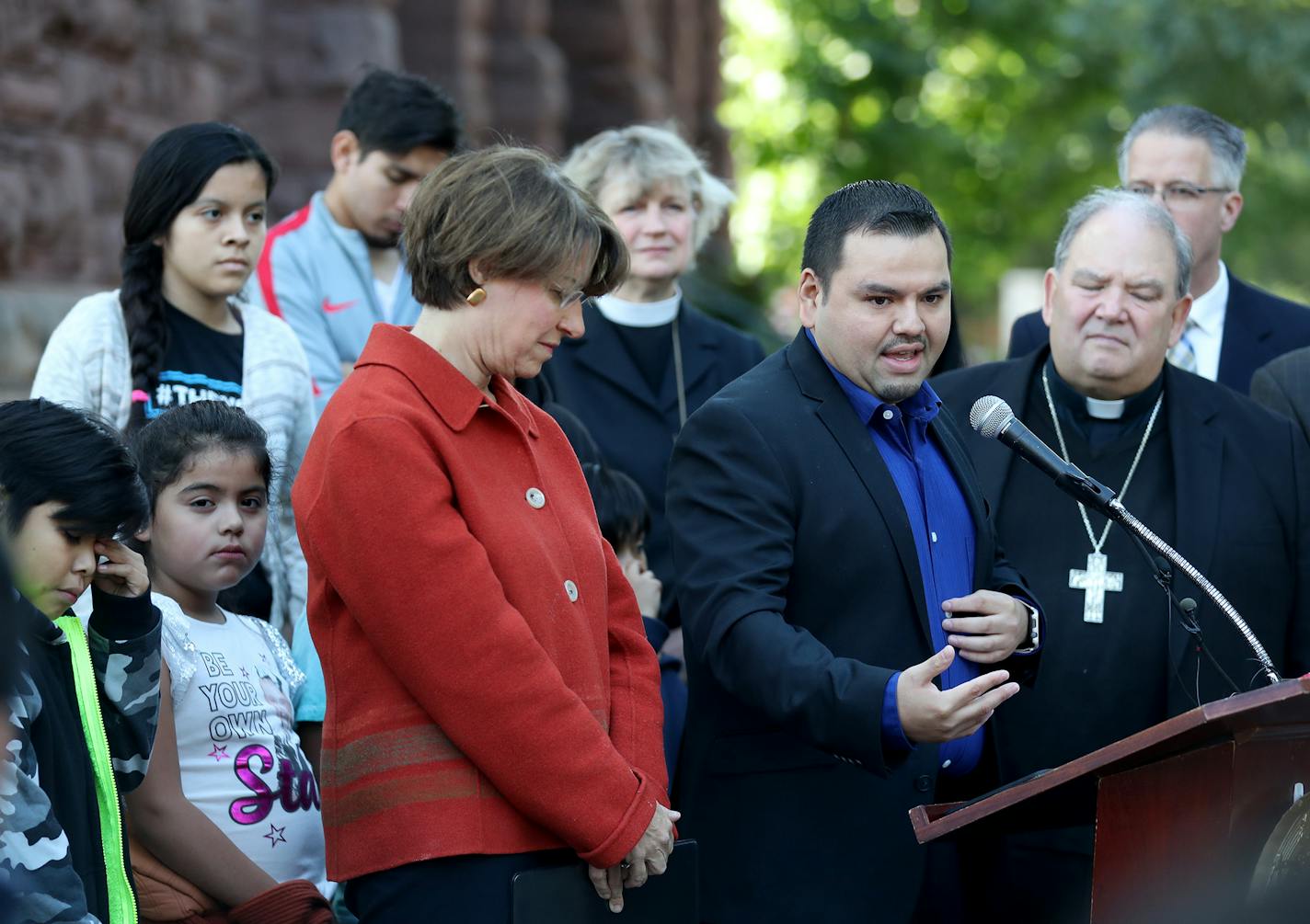 David Soto, 31, a Twin Cities financial adviser, at microphone, flanked by Sen. Amy Klobuchar, left, and Archbishop Bernard Hebda, right, described his experience in coming to the U.S. with his parents from Mexico as a six-year-old boy and growing up here, following a forum on the future of the DACA program at the Church of St. Stephen Saturday, Sept. 9, 2017, in Minneapolis, MN.] DAVID JOLES � david.joles@startribune.com After Tuesday's announcement that the Trump administration will be winding