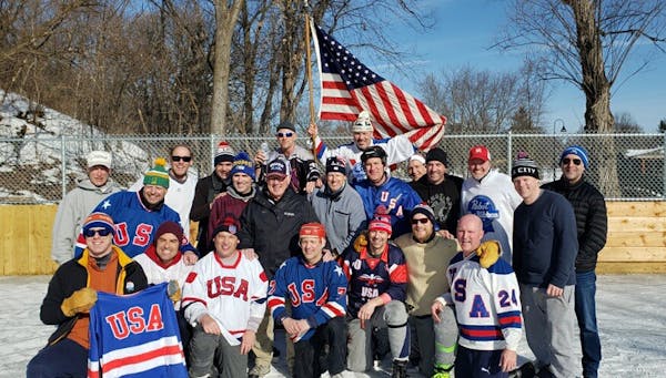 Fred Haberman, second from right in front row (kneeling), with his hockey crew, marking the 40th anniversary of the 1980 "Miracle on Ice" at its recen