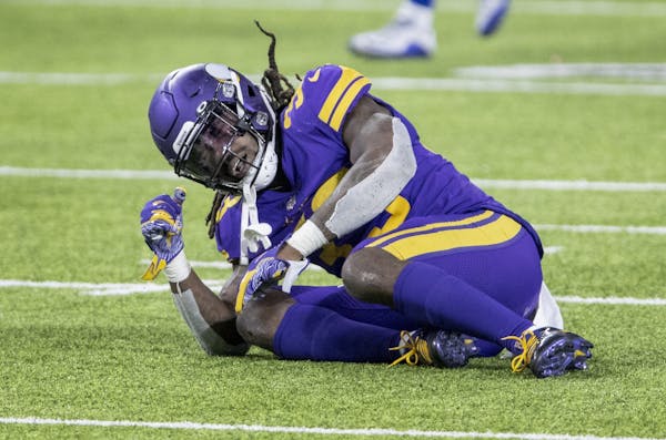 Minnesota Vikings running back Dalvin Cook (33) was slow to get up after fumbling the ball in the second quarter.