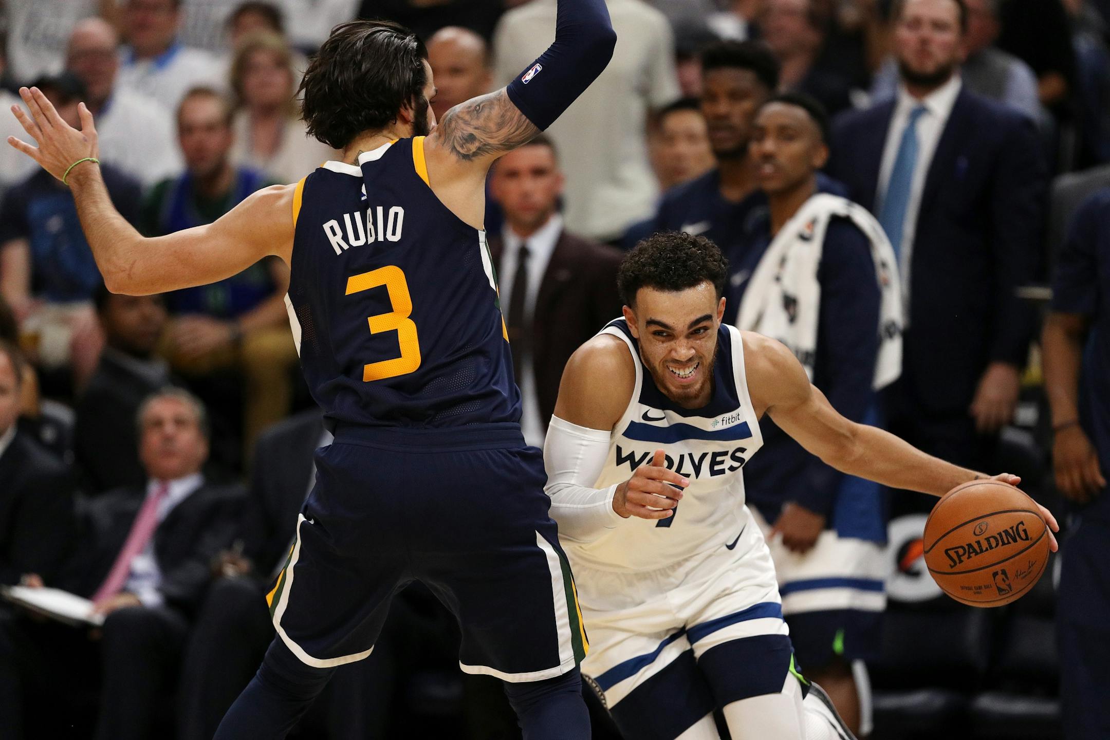 Minnesota Timberwolves guard Tyus Jones (1) drove to the basket as Utah Jazz guard Ricky Rubio (3) defended in the second half.