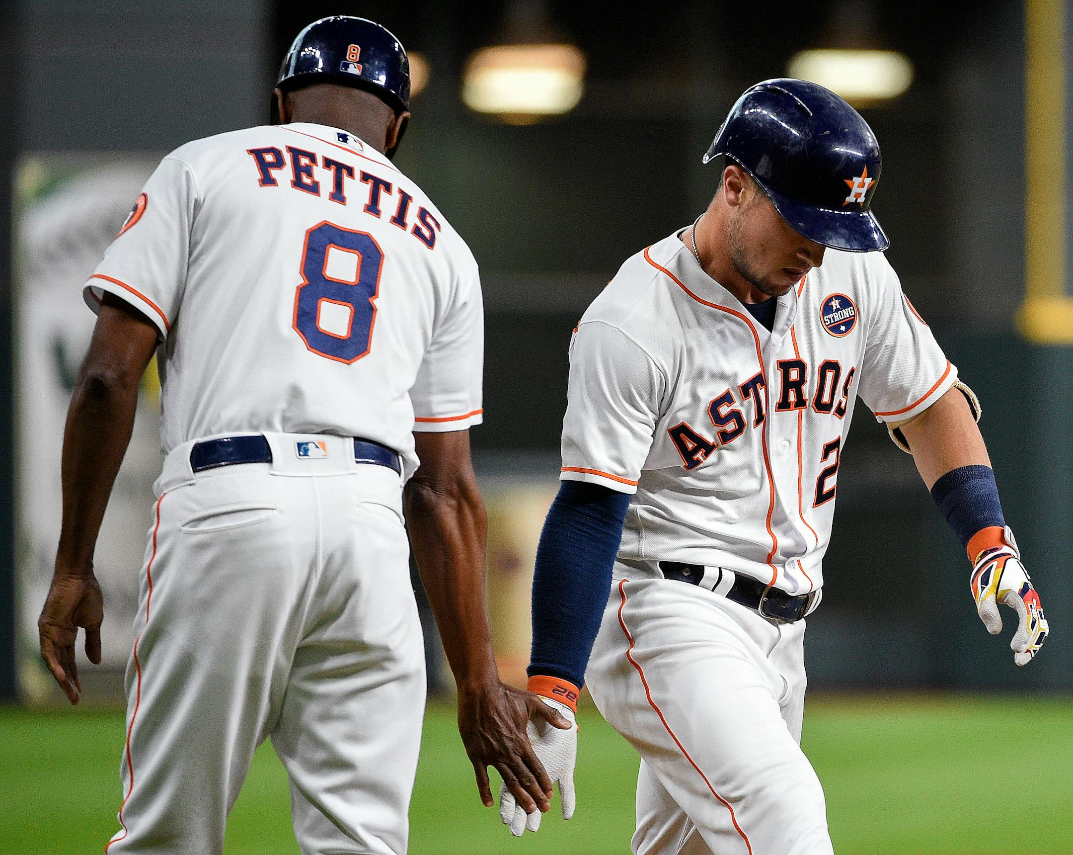 Houston Astros' Alex Bregman, right, celebrated his solo home run off Twins starter Kyle Gibson with third base coach Gary Pettis during the first inning Monday.