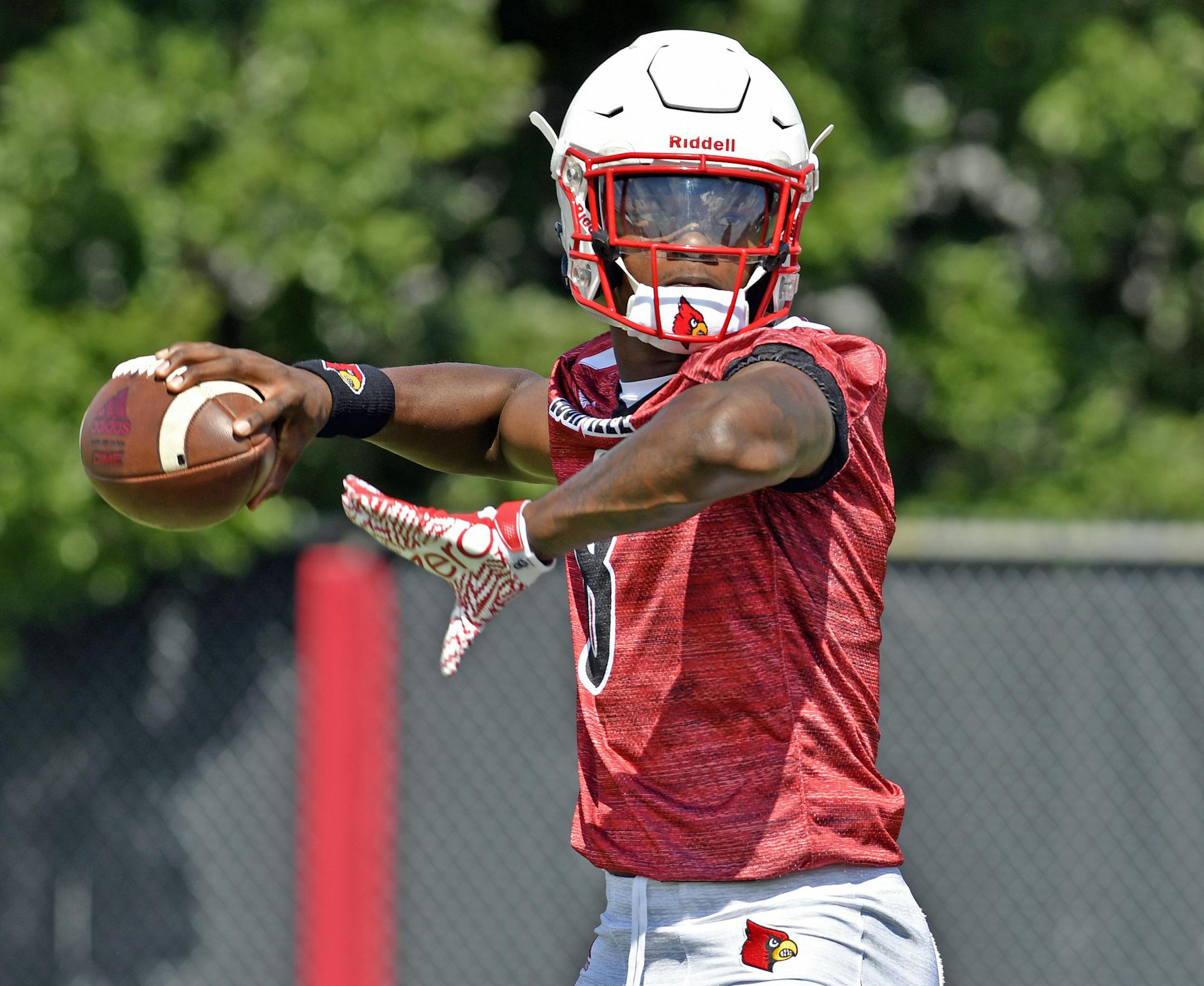University of Louisville quarterback Lamar Jackson participates in drills during the first open practice of the season, Monday, July. 31, 2017, in Louisville, Ky. (AP Photo/Timothy D. Easley) ORG XMIT: MIN2017082520024893