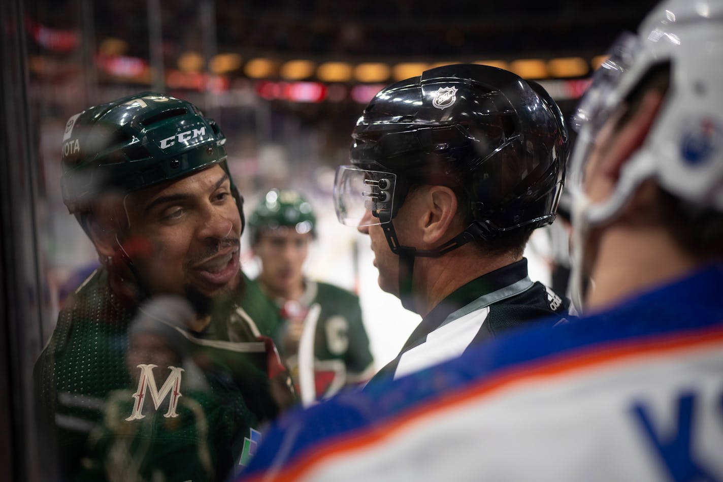 Minnesota Wild right wing Ryan Reaves (75) and Edmonton Oilers center Klim Kostin (21) exchange words after the buzzer ended the first period Thursday, Dec. 1, 2022, at Xcel Energy Center in St. Paul, Minnesota. (Jeff Wheeler/Minneapolis Star Tribune/TNS) ORG XMIT: 70648164W