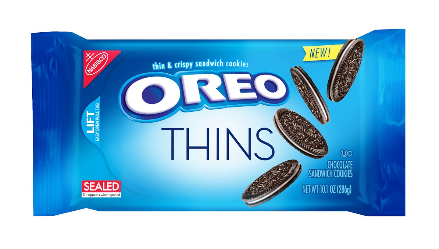 This product image provided by Mondelez shows the packaging design for "Oreo Thins." Mondelez International Inc. says it will add "Oreo Thins," which have a similar cookie-to-filling ratio as regular Oreos, except that they're slimmer, to its permanent lineup in the U.S. starting next week. (Mondelez via AP)