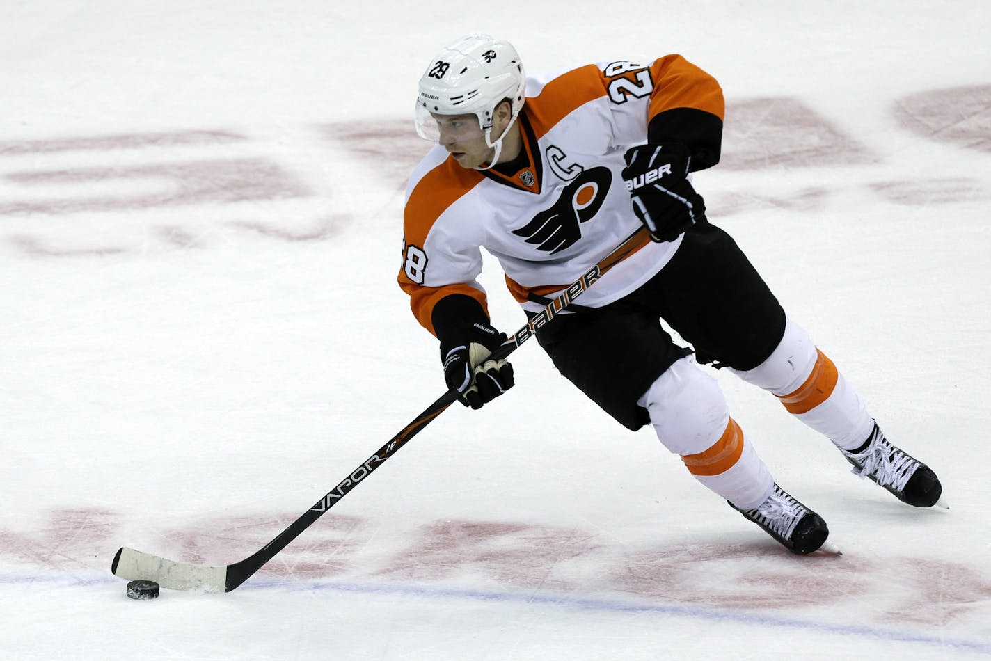 In this March 24, 2013, photo, Philadelphia Flyers center Claude Giroux skates during an NHL hockey game against the Philadelphia Flyers in Pittsburgh. The Flyers on Friday, July 5, 2013, signed Giroux to an eight-year extension worth over $64 million. They followed that with a $1.65 million, one-year deal with goalie Ray Emery. They even signed former Edmonton goalie Yann Danis to a one-year, two-way contract. (AP Photo/Gene J. Puskar)