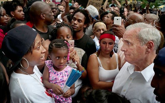 Governor Mark Dayton met with family members including Diamond Reynolds and her daughter, far left.