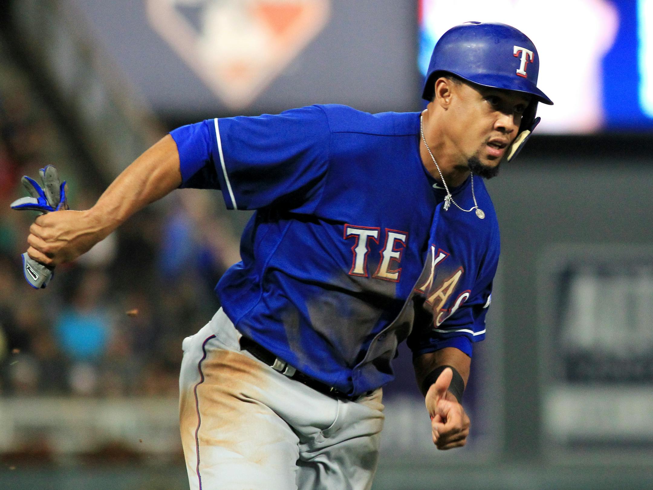 Texas Rangers Carlos Gomez (14) runs in to score against the Minnesota Twins during the ninth inning of a baseball game Saturday, Aug. 5, 2017, in Minneapolis. The Rangers won 4-1. (AP Photo/Andy Clayton-King)