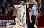 Gophers center Liam Robbins grabbed his lower left leg after a hard fall in the second half vs. Purdue.