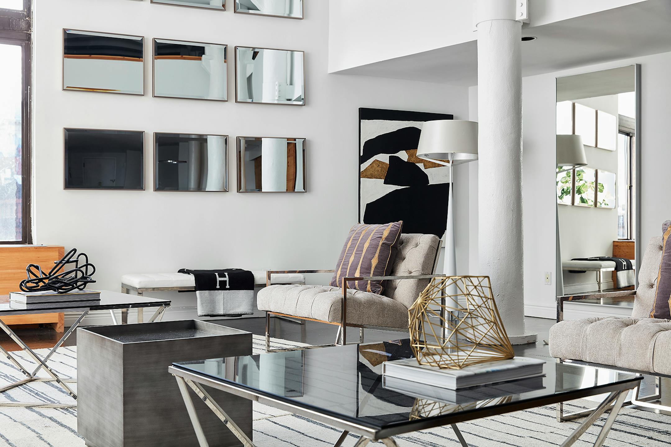 A long bench helps to add an industrial vibe to a loft space. (Handout/TNS)