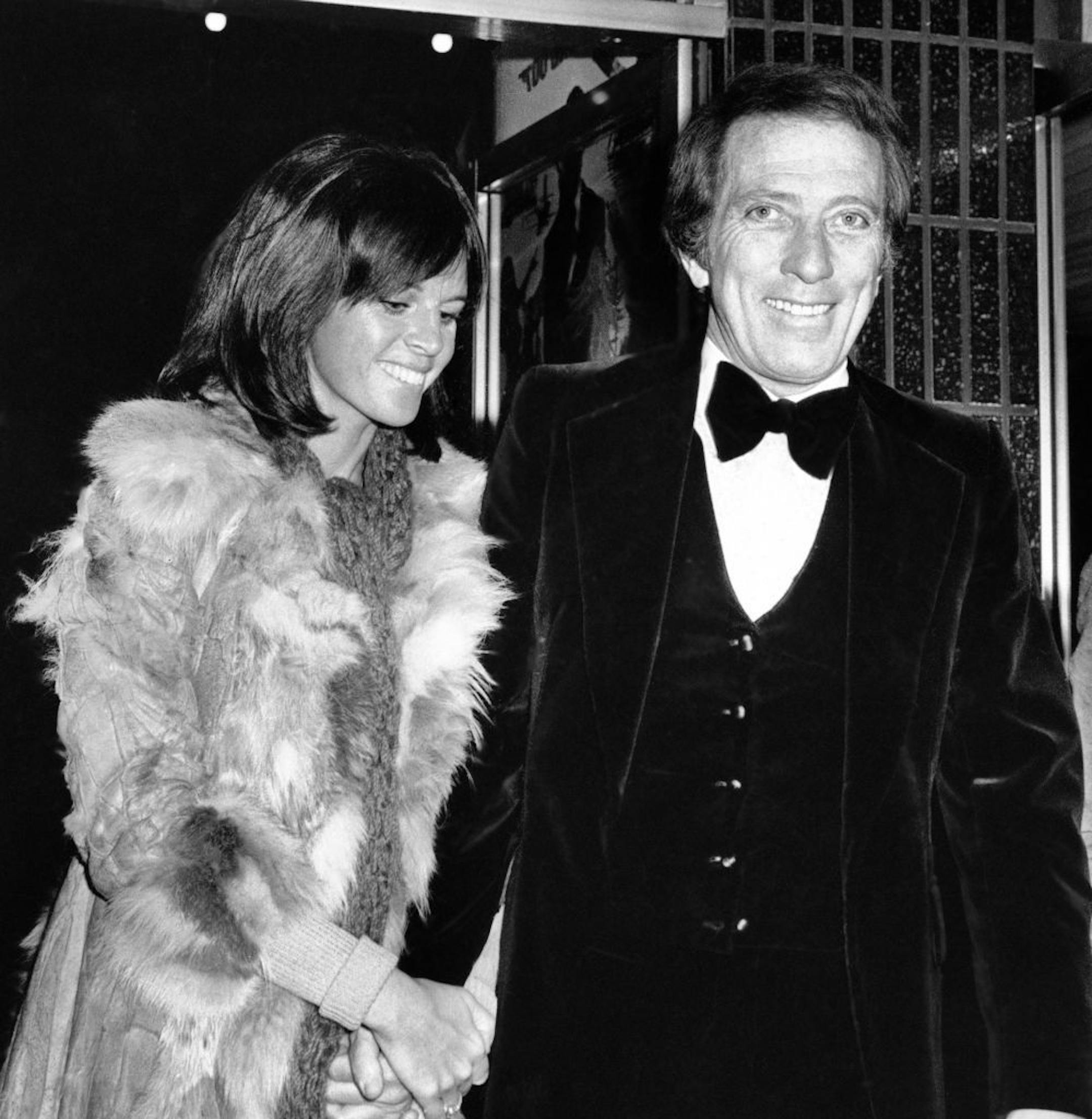 FILE - In a Dec. 19, 1974 file photo, American singer Andy Williams and his wife Claudine Longet, shown upon arrival at the Odeon, Leicester Square, London, for the Royal Charity World premiere of "The Man With the Golden Gun." Emmy-winning TV host and "Moon River" crooner Williams died Tuesday night, Sept, 25, 2012 at his home in Branson, Mo., following a year-long battle with bladder cancer. He was 84.