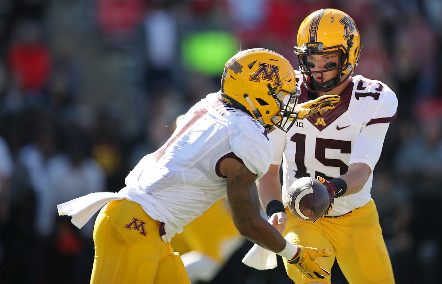 Minnesota quarterback Conor Rhoda handed the ball to running back Rodney Smith, who ran in for a touchdown against Maryland.