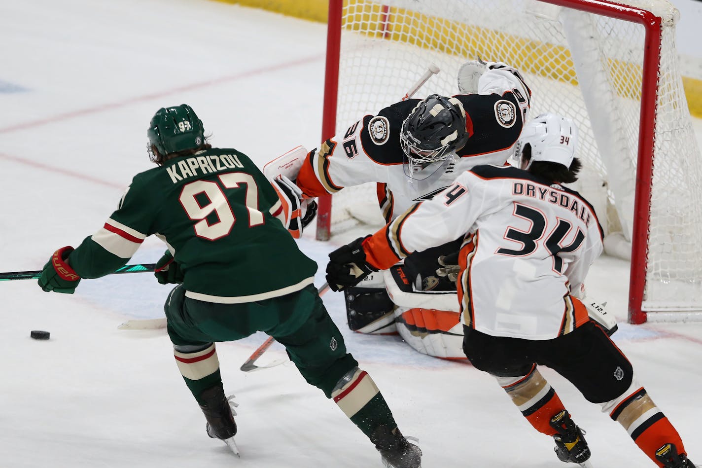 Kirill Kaprizov shoots the puck into the net against Ducks' goalie John Gibson to win in overtime on Friday night.