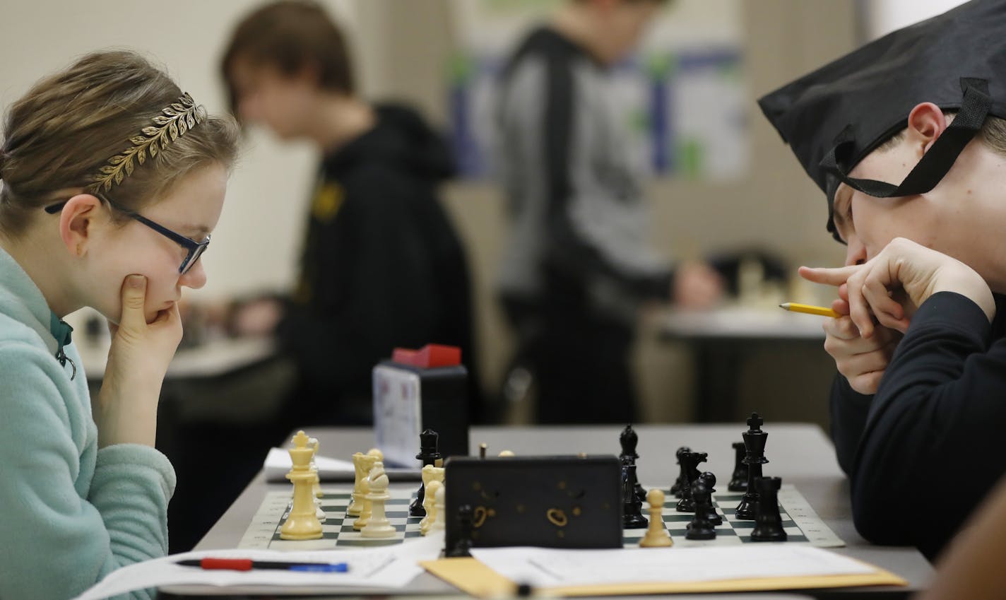 Audra Johnson, 14, plays a game with Will Moe,13. She lost out to a Texas player whose team was allegedly involved in a scheme to favor its class groupings.] The Burnsville Metcalf Junior High School chess team lost out on a national championship to a school from Texas which now has been found to have cheated in a scheme directed by the team's coach.RICHARD TSONG-TAATARII &#xa5; richard.tsong-taatarii@startribune.com