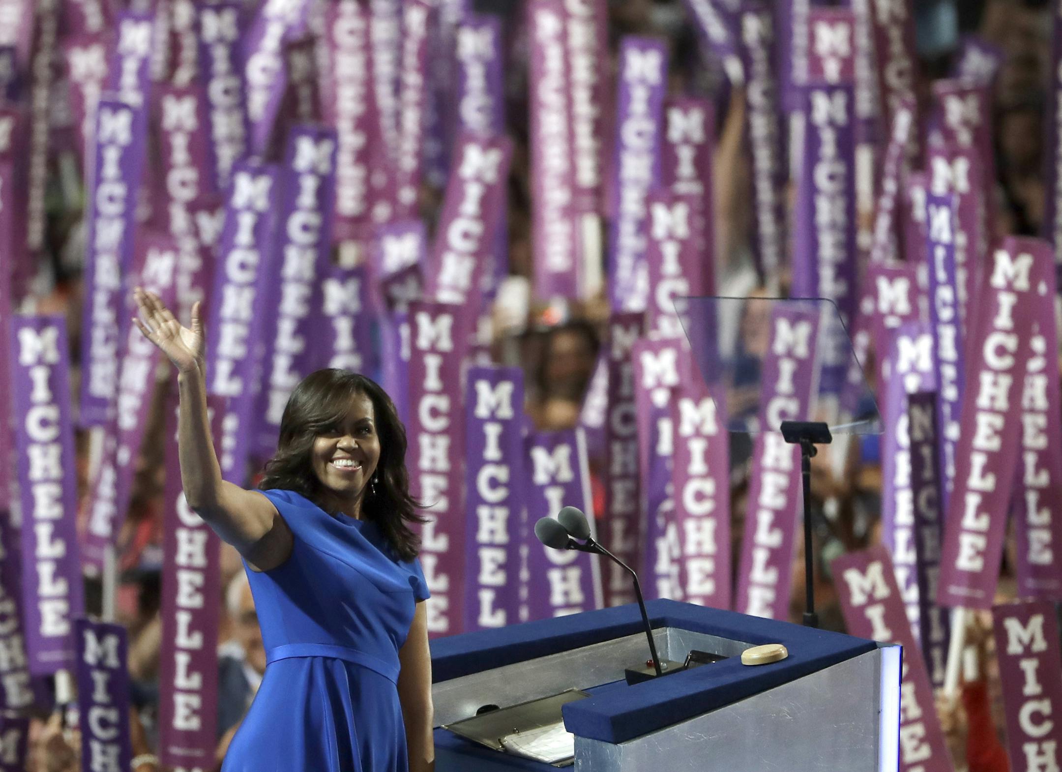 First Lady Michelle Obama waves as she speaks to delegates during the first day of the Democratic National Convention in Philadelphia , Monday, July 25, 2016. (AP Photo/Matt Rourke)