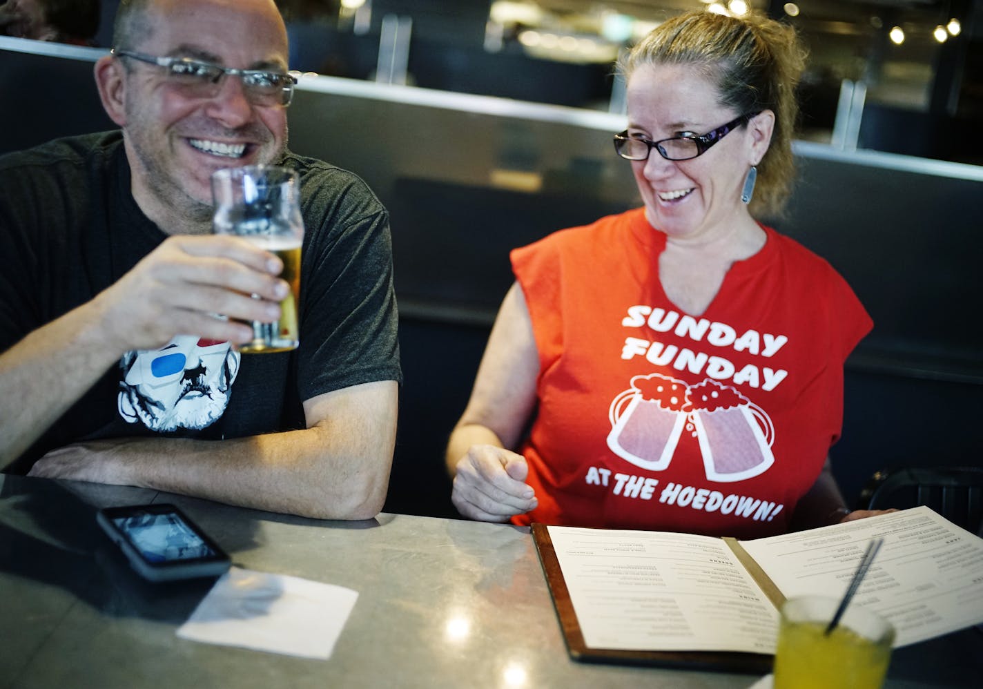 At the Freehouse, Doug and Stephanie Menning enjoyed a craft beer and a screwdriver respectively before 10 a.m. on Sunday thanks to the new liquor law. ] Richard Tsong-Taatarii/rtsong-taatarii@startribune.com