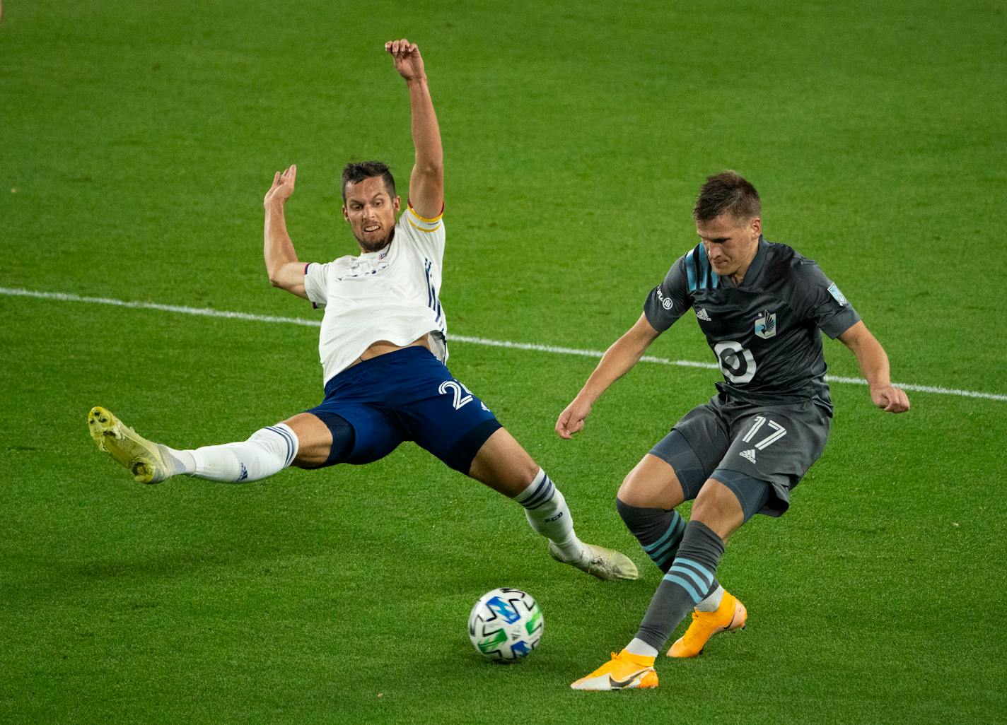 FC Dallas defender Matt Hedges reached to break up a first half pass by Minnesota United midfielder Robin Lod