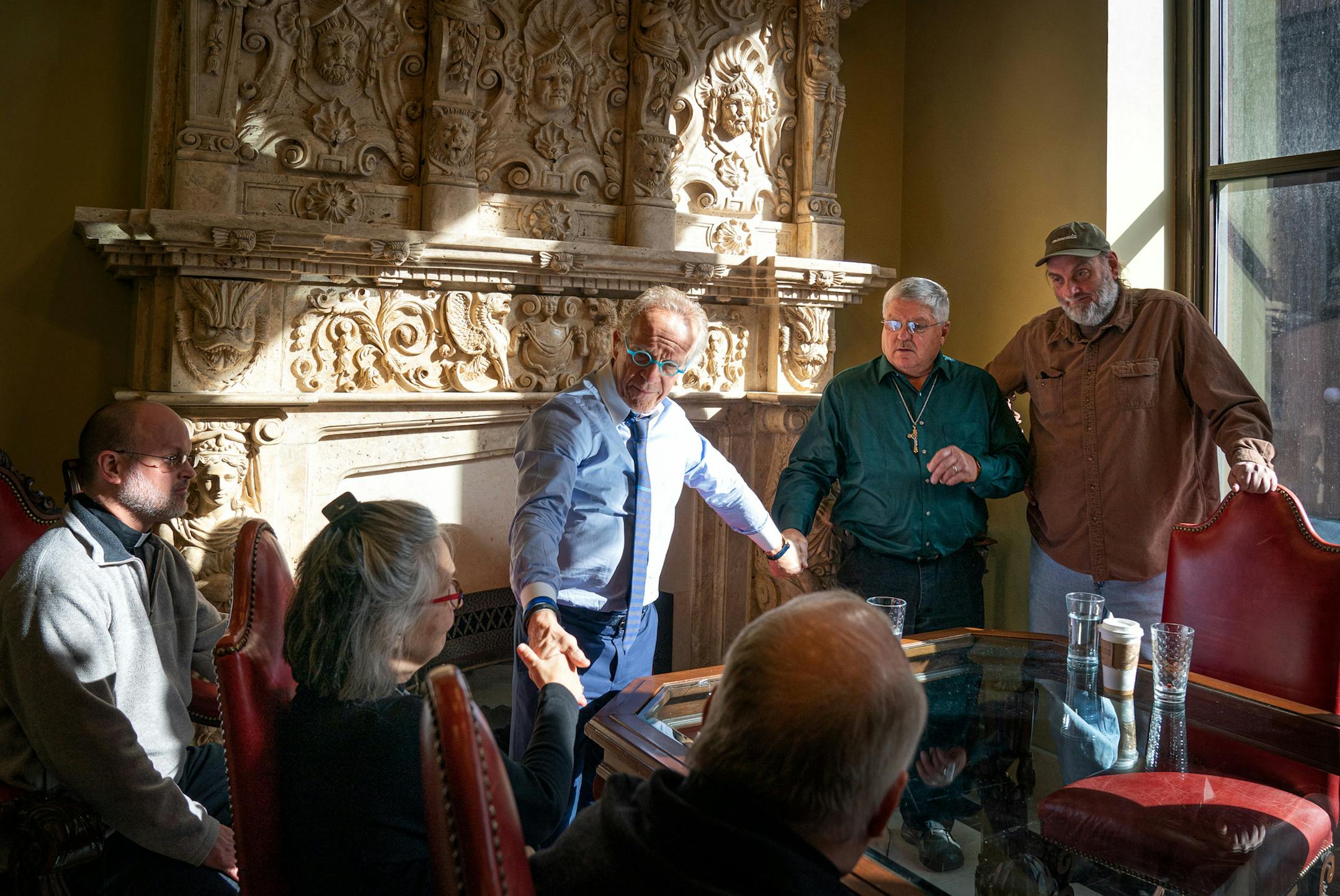 Attorney Jeff Anderson held hands with Ron Vasek and his wife Patty as he met privately with abuse survivors Ron Vasek and Pat Matuseski, right, before holding a press conference where he called for the removal of Bishop Richard Malone of Buffalo, NY and Bishop Michael Hoeppner of Crookston who he accuses of sheltering abusive priests. On the left are Msgr David Baumgartner, Ron's wife Patty Vasek, and Fr. Bob Schreiner. ] GLEN STUBBE • glen.stubbe@startribune.com Tuesday, November 5, 201