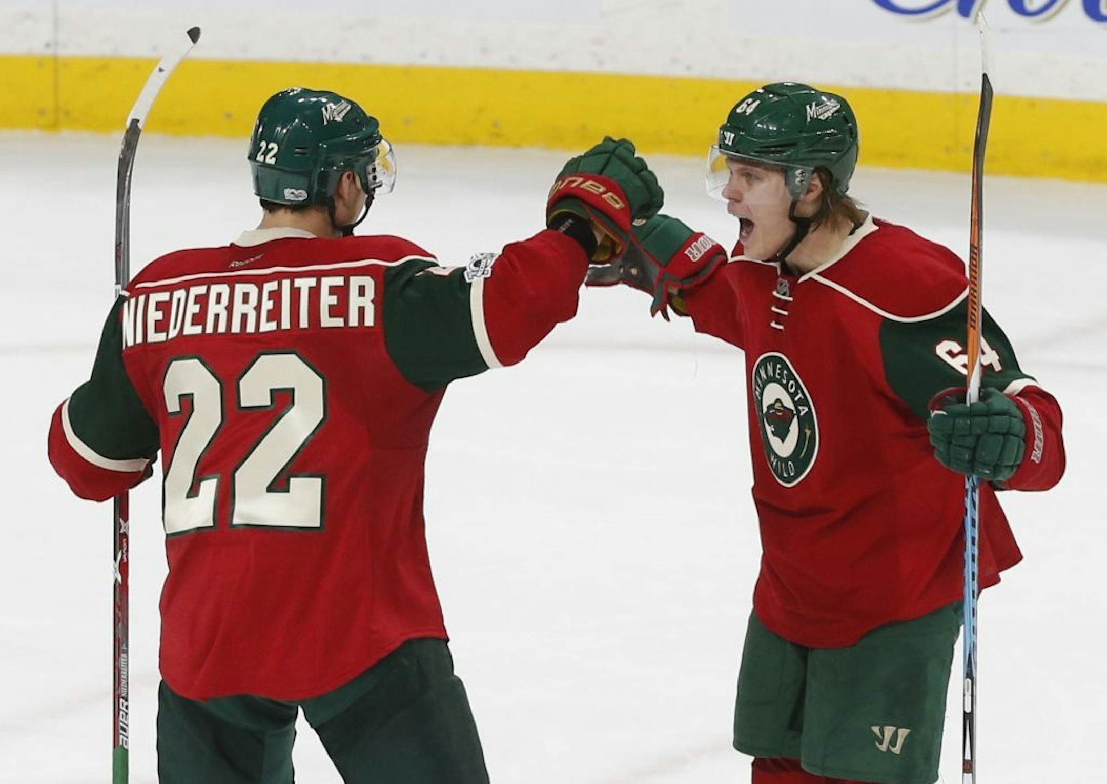Mikael Granlund, right, celebrates a goal with Nino Neiderreiter last season. Their contracts will determine other moves that Wild general manager Chuck Fletcher can make under the NHL salary cap.