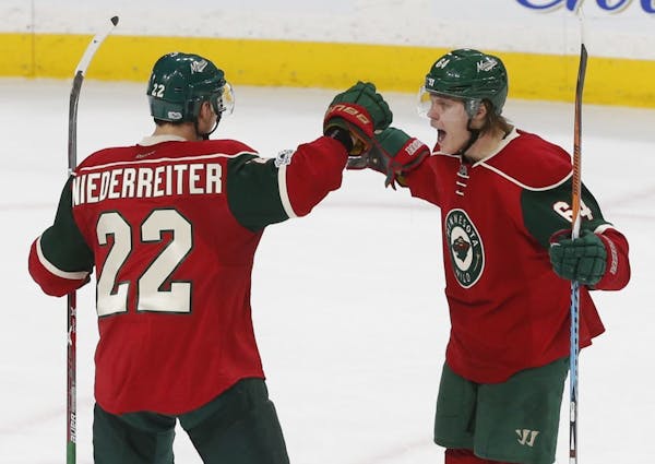 Mikael Granlund, right, celebrates a goal with Nino Neiderreiter last season. Their contracts will determine other moves that Wild general manager Chu