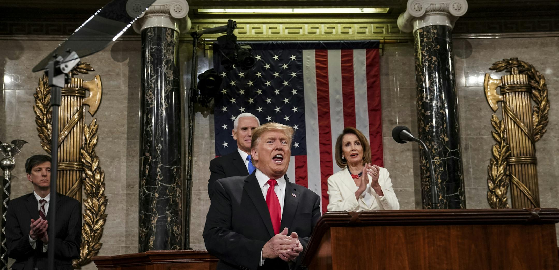 President Donald Trump gives his State of the Union address to a joint session of Congress, Tuesday, Feb. 5, 2019 at the Capitol in Washington, as Vice President Mike Pence, left, and House Speaker Nancy Pelosi look on. (Doug Mills/The New York Times via AP, Pool)