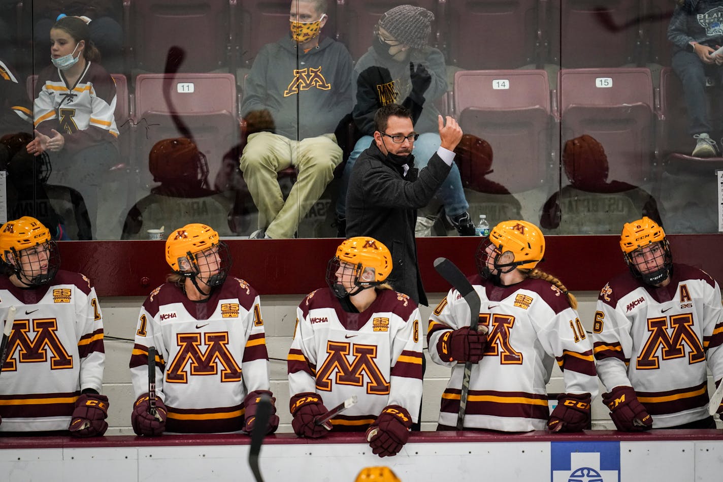 Gophers coach Brad Frost signaled to his players during Friday night's season opener at Ridder Arena.