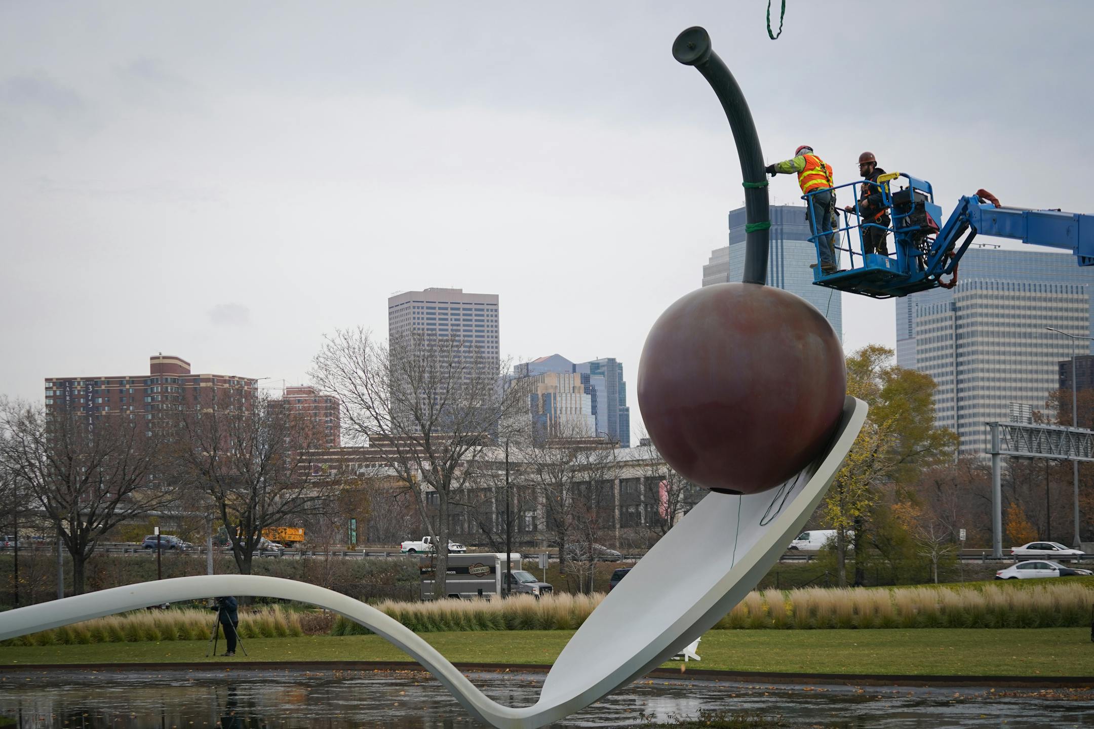 The 17500 pound aluminum cherry ball is unbolted, lifted, and separated from the Spoonbridge base it sits atop at the Sculpture Garden in Minneapolis, Minn., on Tuesday, Nov. 16, 2021. Due to the typically harsh conditions of Minnesota winters, this iconic Minneapolis fruit requires a fresh coat of paint about every ten years to keep the cherry's red crisp and glossy. ] SHARI L. GROSS • shari.gross@startribune.com