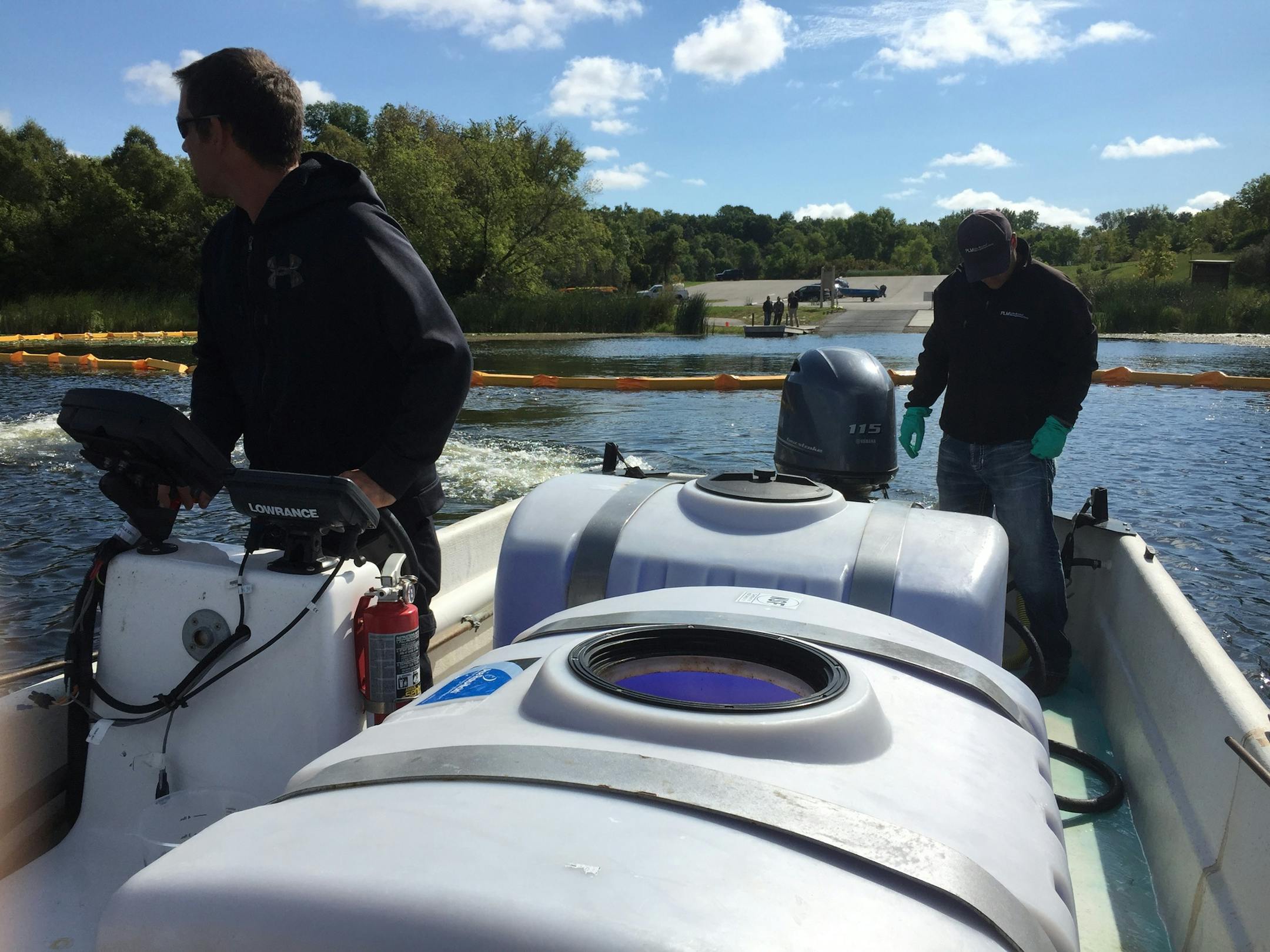 Crews from PLM Lake and Land Management use a copper product on Lake Minnewashta on Tuesday to kill off zebra mussels discovered near its boat launch last month. Photo courtesy of the Minnehaha Creek Watershed District.