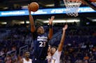 Timberwolves rookie guard Jarrett Culver (23) shot over Suns forward Cameron Johnson during the first half of a preseason NBA game Tuesday. He scored 