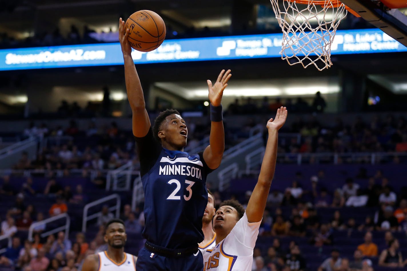 Timberwolves rookie guard Jarrett Culver (23) shot over Suns forward Cameron Johnson during the first half of a preseason NBA game Tuesday. He scored 11 points on 5-for-8 shooting, but also had four turnovers in 25 minutes.