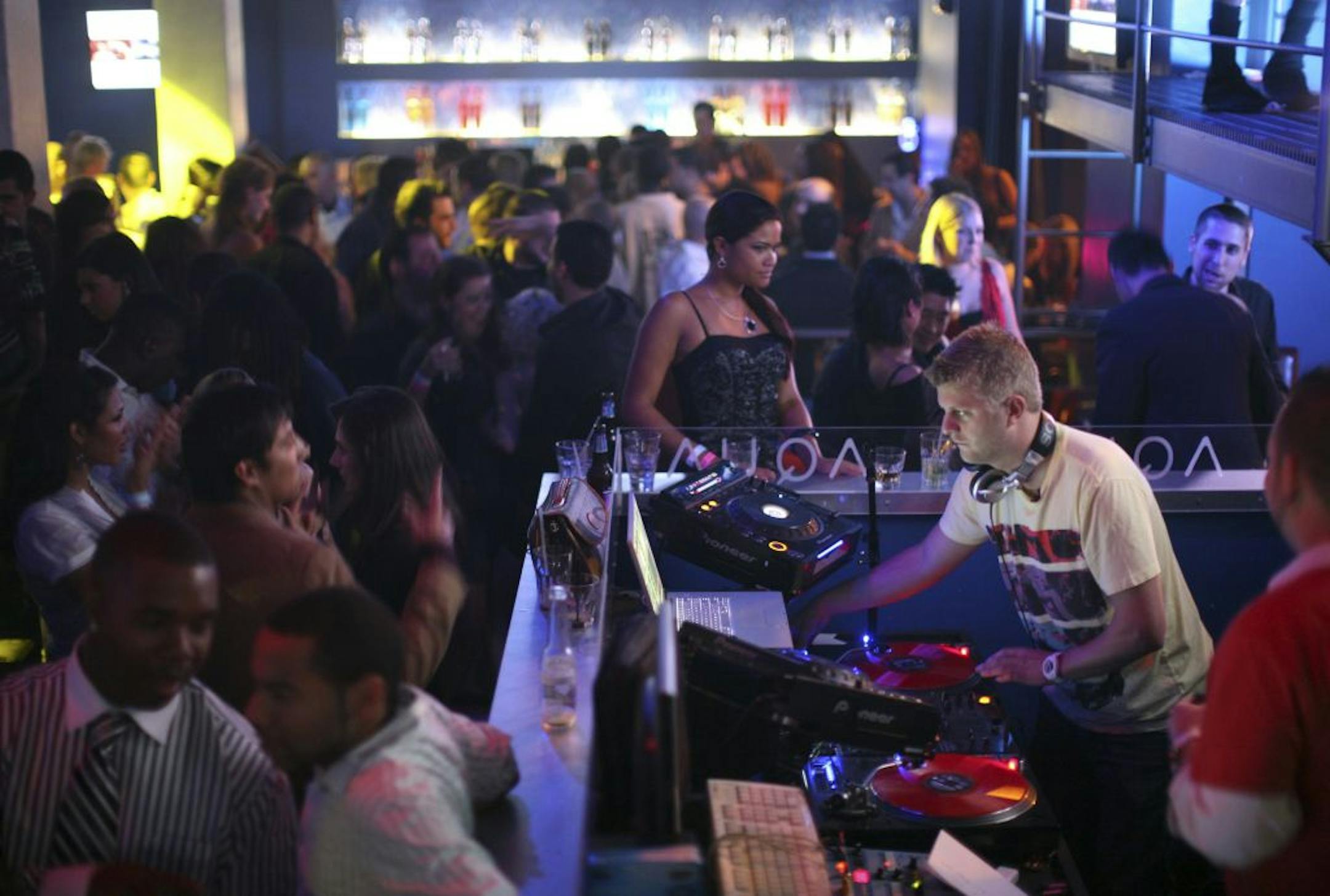 DJ Joe Maz plying his trade in the booth at Aqua on a recent Friday night.