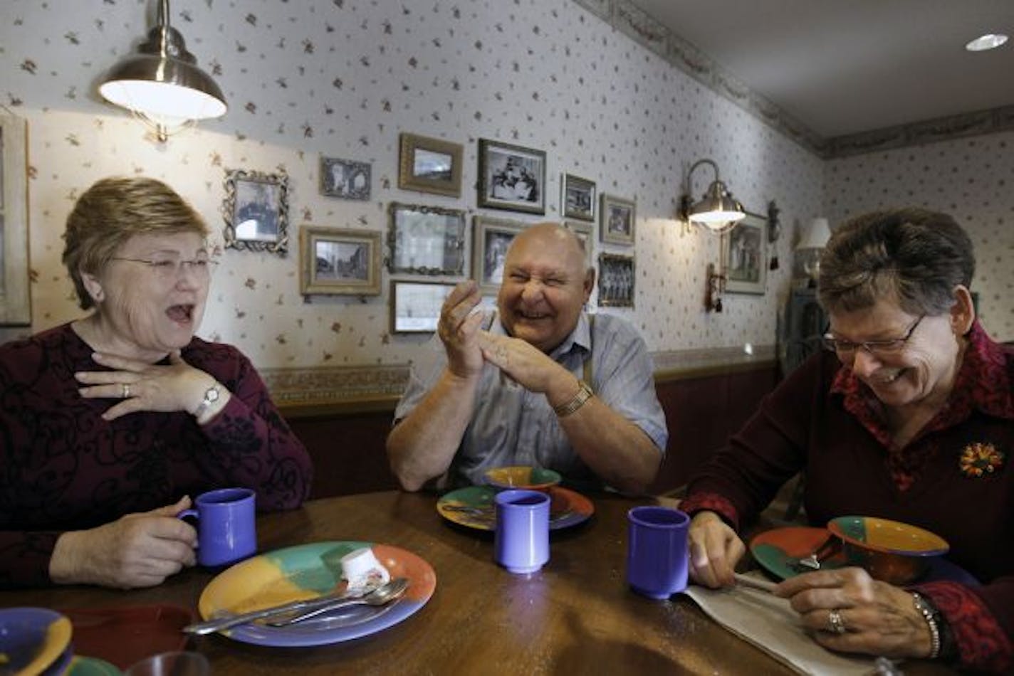 A 'Continuum of Care' village: Mary Leisman, 77, left, Roger Pivoran, 68, and his wife, Louise, 67, talked about life during WWII over breakfast at Boutwell Landing in Oak Park Heights.