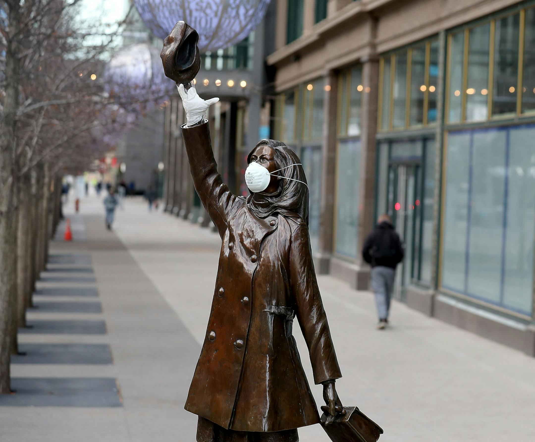 The Mary Tyler Moore statue on Nicollet Mall got a mask and rubber glove, perhaps for levity in the face of the Coronavirus, and seen Wednesday, April 1, 2020, in downtown Minneapolis, MN.