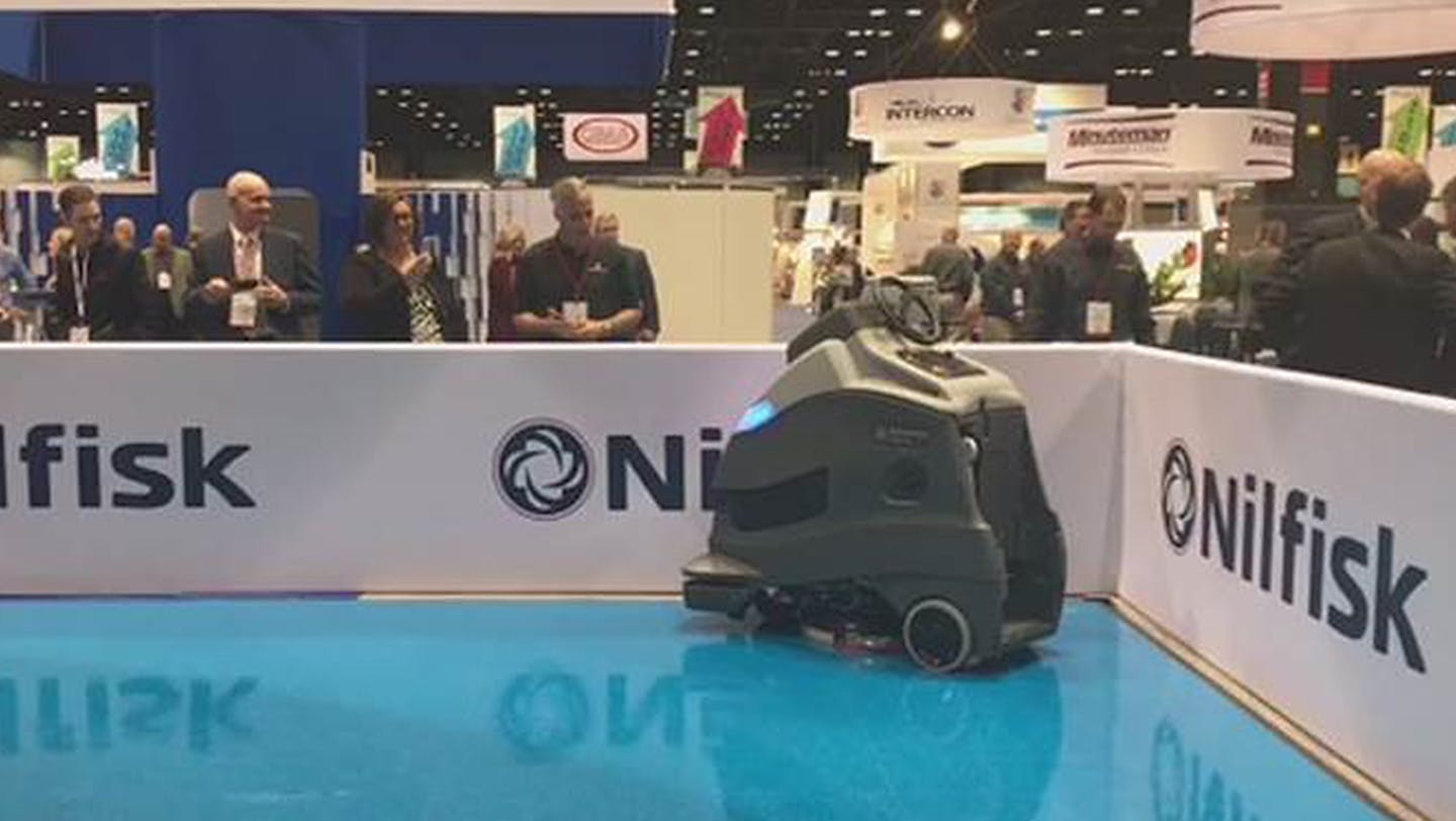 Nilfisk and Carnegie Robotics officials debut their new robotic (driverless) floor-scrubber at the industry ISSA trade show last month in Chicago.