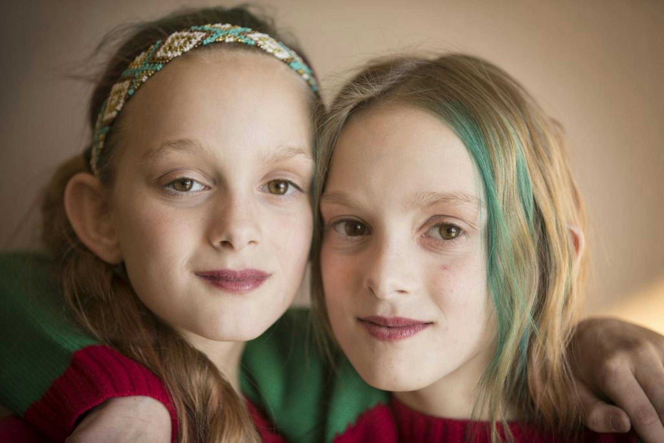 Isabelle, left, and Abby Carlsen pose for a portrait.