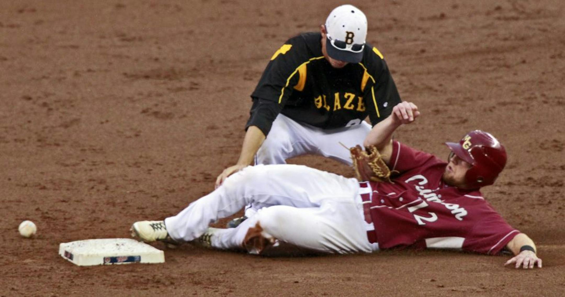 The ball got away from Burnsville's Matt Stemper, top as Maple Grove's Logan Hershey (12) stole second base in 3rd inning action.