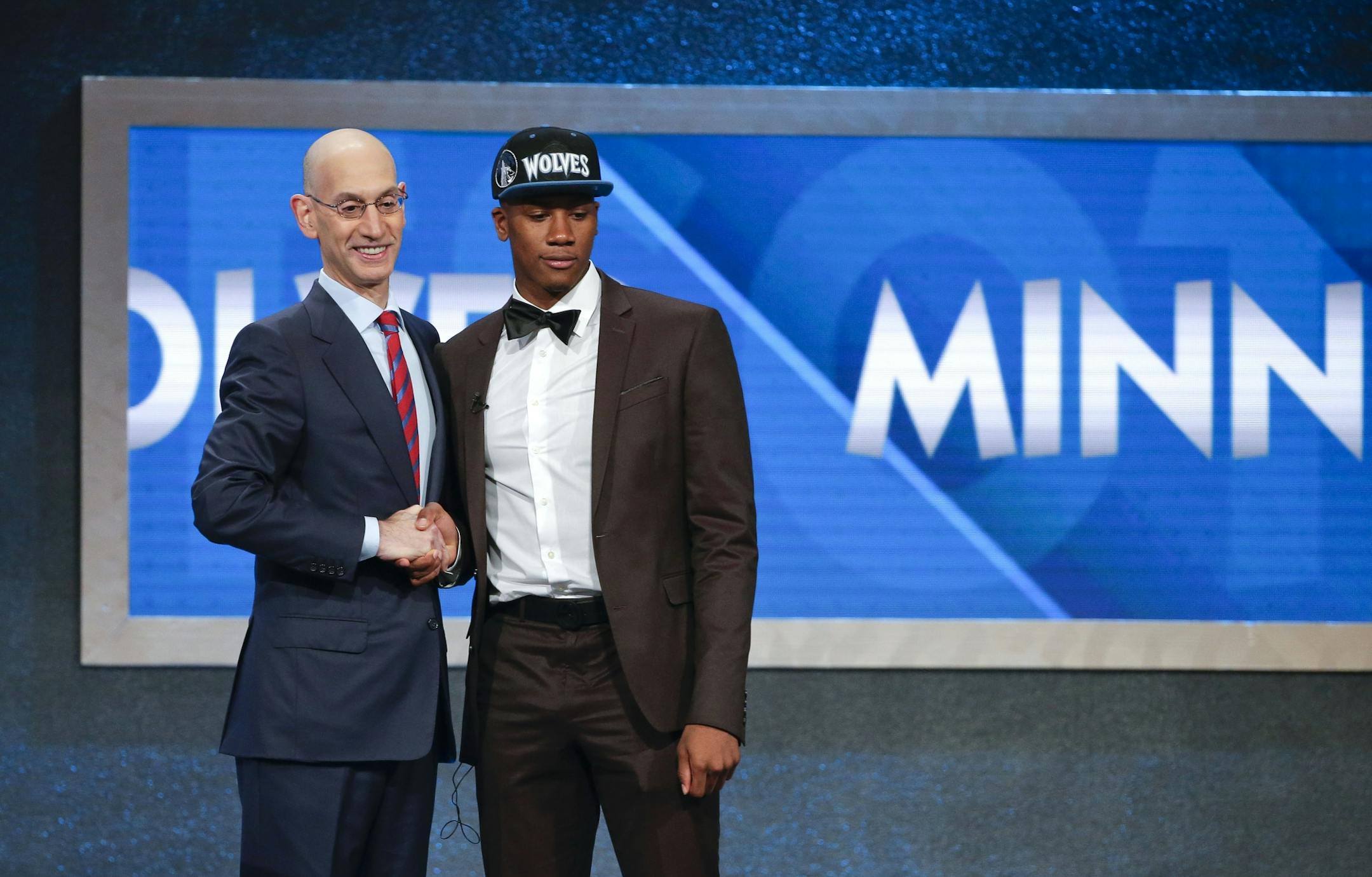 Kris Dunn, right, poses for a photo with NBA Commissioner Adam Silver after being selected fifth overall by the Minnesota Timberwolves during the NBA basketball draft, Thursday, June 23, 2016, in New York.