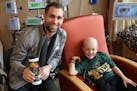Jason Zucker and his young friend Tucker Helstrom, who died earlier this month.