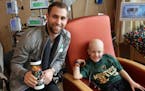 Jason Zucker and his young friend Tucker Helstrom, who died earlier this month.
