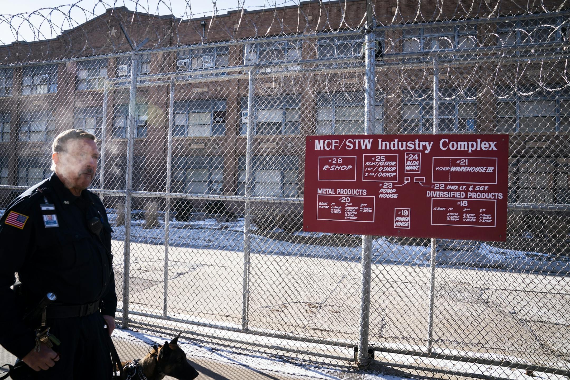 Corrections officer Rick Jennings and a dog stood outside at Stillwater prison on Jan. 25.