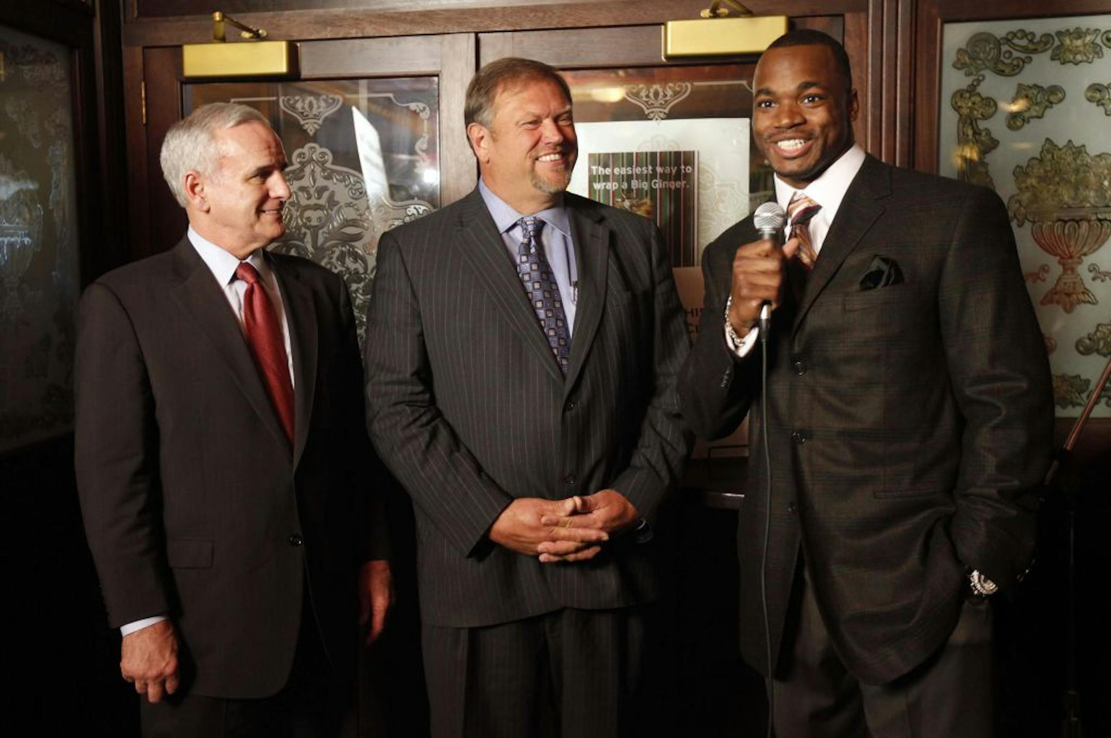 Governor-elect Mark Dayton, Senate Minority Leader Tom Bakk and Vikings Running Back Adrian Peterson addressed the media during a Hunger Solutions Food Shelf Fundraiser at Liffy Irish Pub in St. Paul. Hunger Solutions Minnesota is a comprehensive hunger relief organization that works to end hunger in Minnesota. They take action to assure food security for all Minnesotans by supporting over 300 agencies that provide food to those in need, advancing sound public policy, and guiding grassroots advo