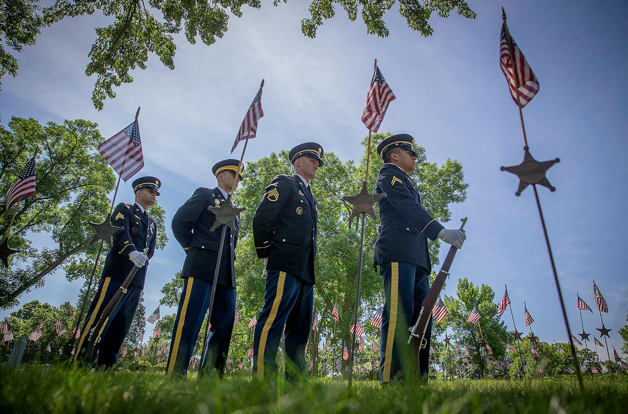 The Lakewood Cemetery Color Guard stood in honor as Takako Seimiya Senn performed "Taps" at the annual Memorial Day Ceremony at Lakewood Cemetery, Monday, May 28, 2018 in Minneapolis, MN.