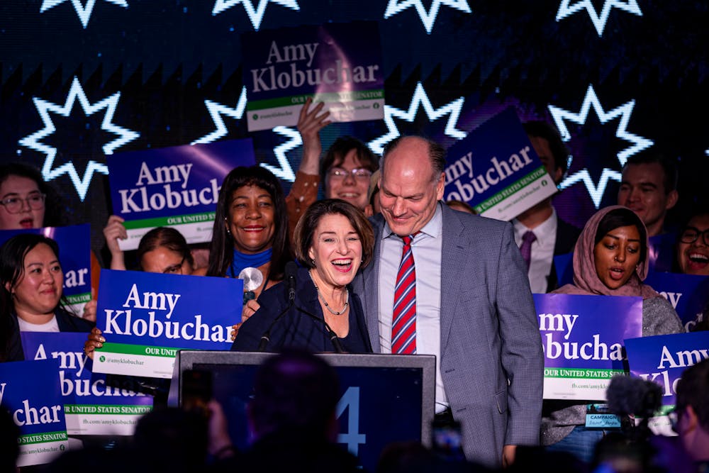 U.S. Sen. Amy Klobuchar, DFL-Minn., hugs her husband, John Bessler, during a DFL election night watch party at the InterContinental St. Paul Riverfront in St. Paul on Tuesday.