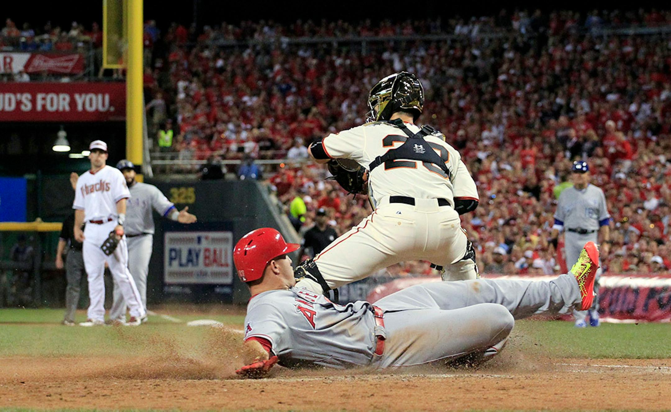 American League's Mike Trout, of the Los Angeles Angels, scores on a hit by American League's Prince Fielder, of the Texas Rangers, during the fifth inning of the MLB All-Star baseball game, Tuesday, July 14, 2015, in Cincinnati.