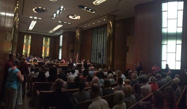 The crowd filled the St. Paul City Council Chambers and went out the door to weigh in on the city's proposed sick leave ordinance.