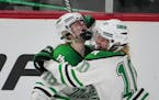 Hill-Murray forward Chloe Boreen (18) celebrates a second-period goal against Roseau with teammate Sophie Olson (10) in Thursday's first Class 2A girl